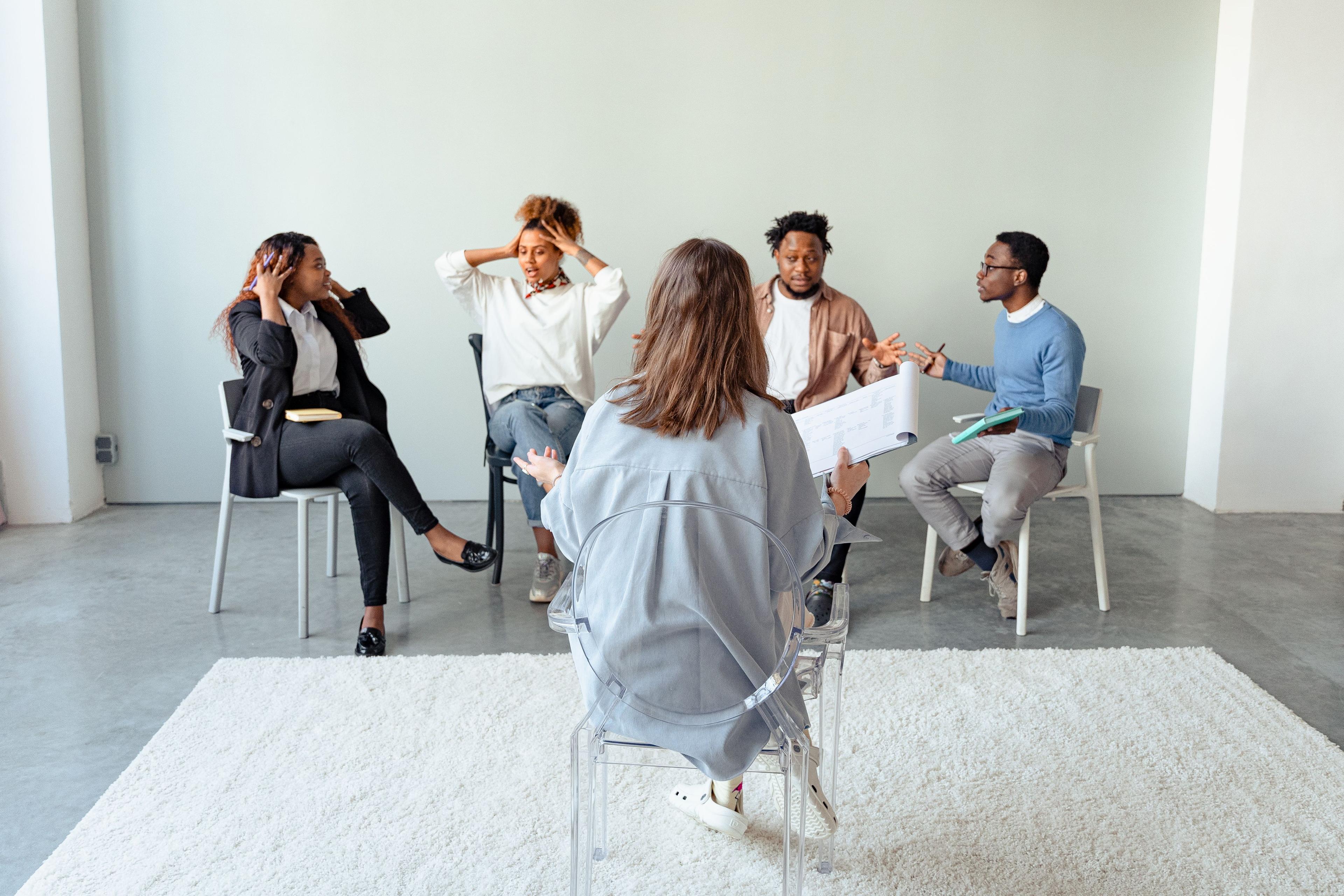 A support group seated in a circle during a session