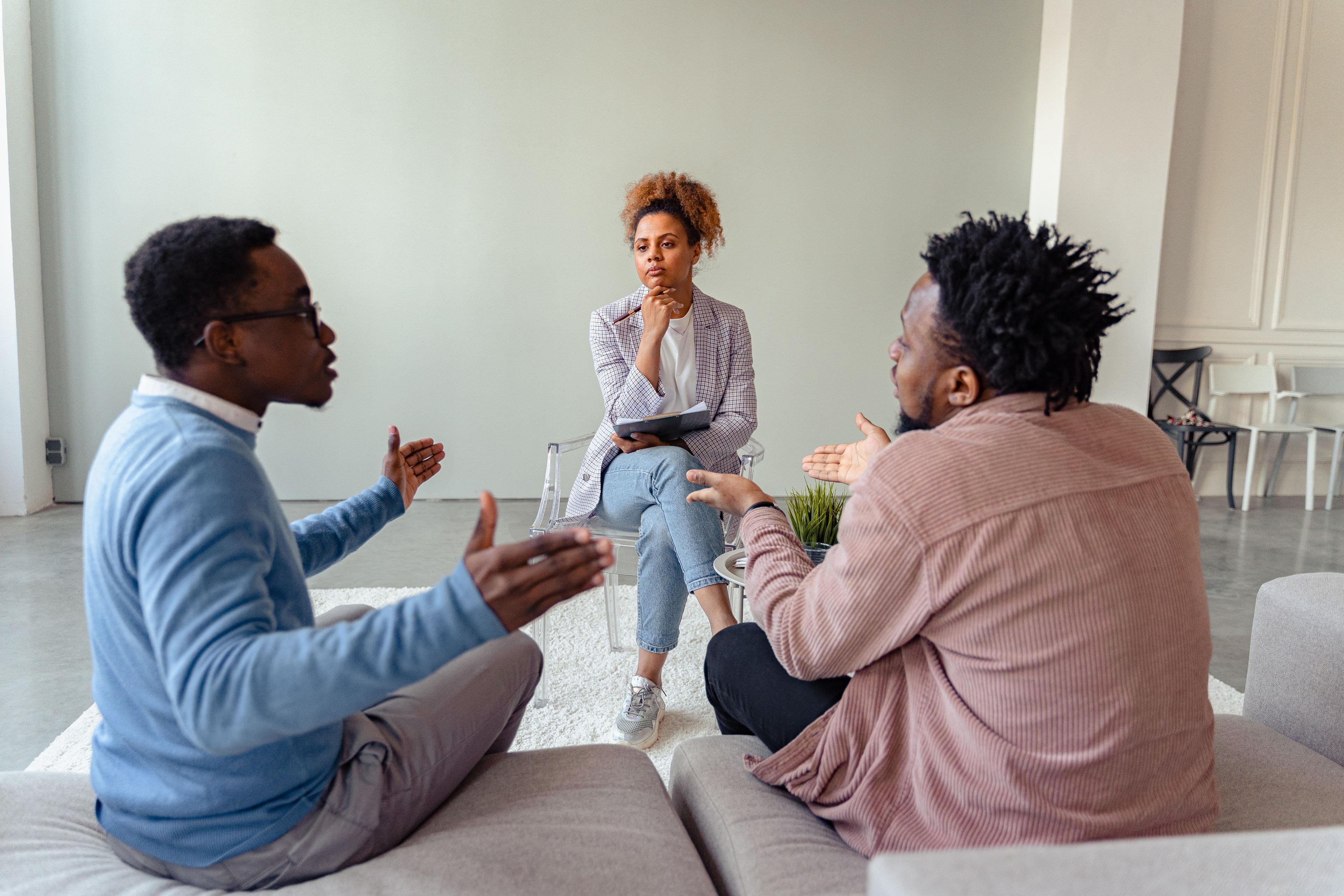 Two people seated together during a couple counselling session