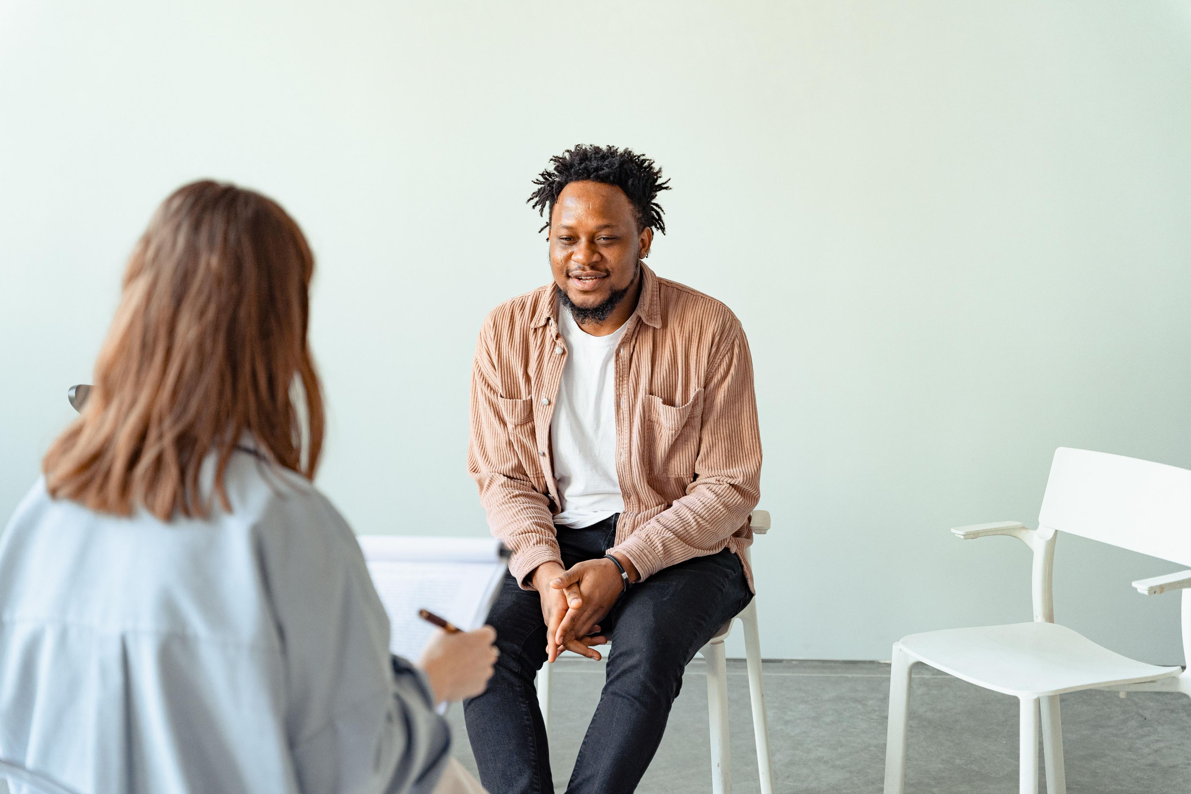 A therapist and client in conversation during a session